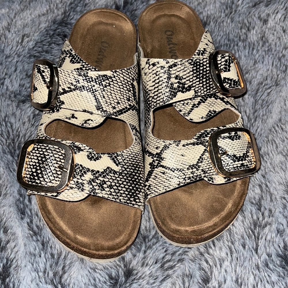 Snakeskin slip on sandals with gold buckle